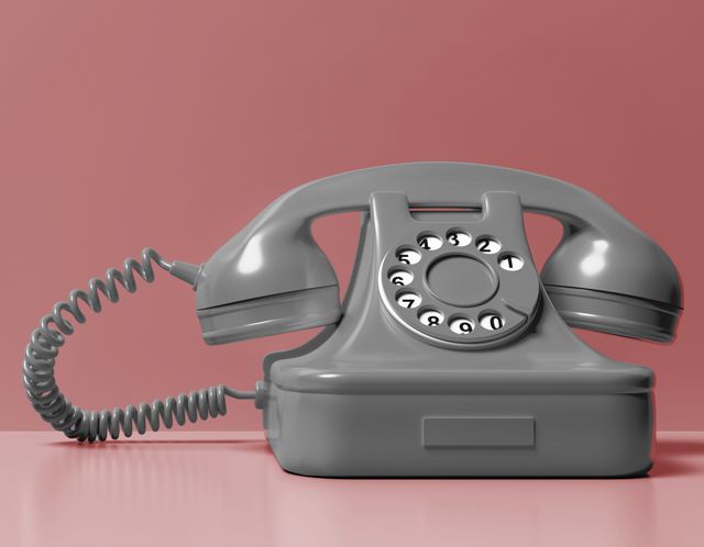 Altes Telefon auf farbigem Hintergrund